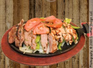 Sizzling fajitas with peppers — Mexican cuisine at Lookin Good Restaurant